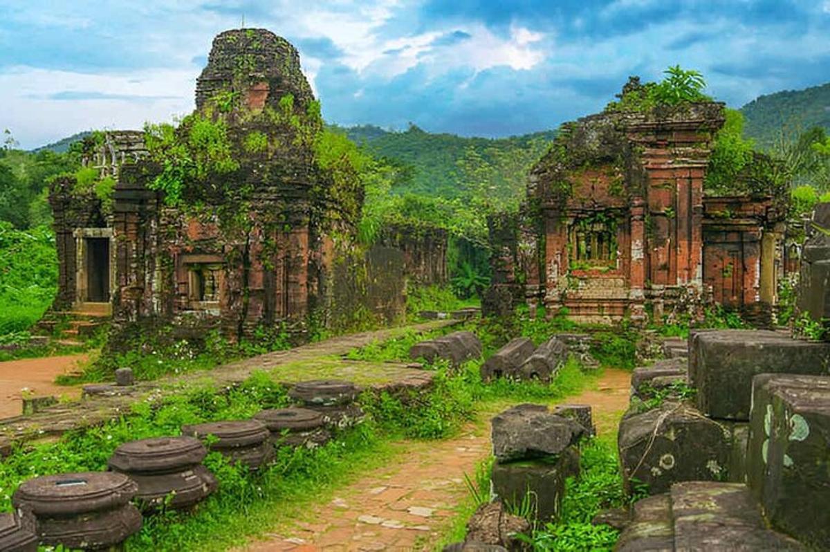 an old building with some ruins in a field