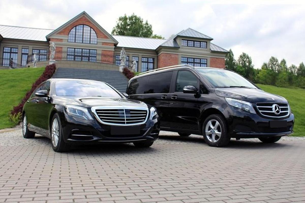 two vehicles parked in front of a house