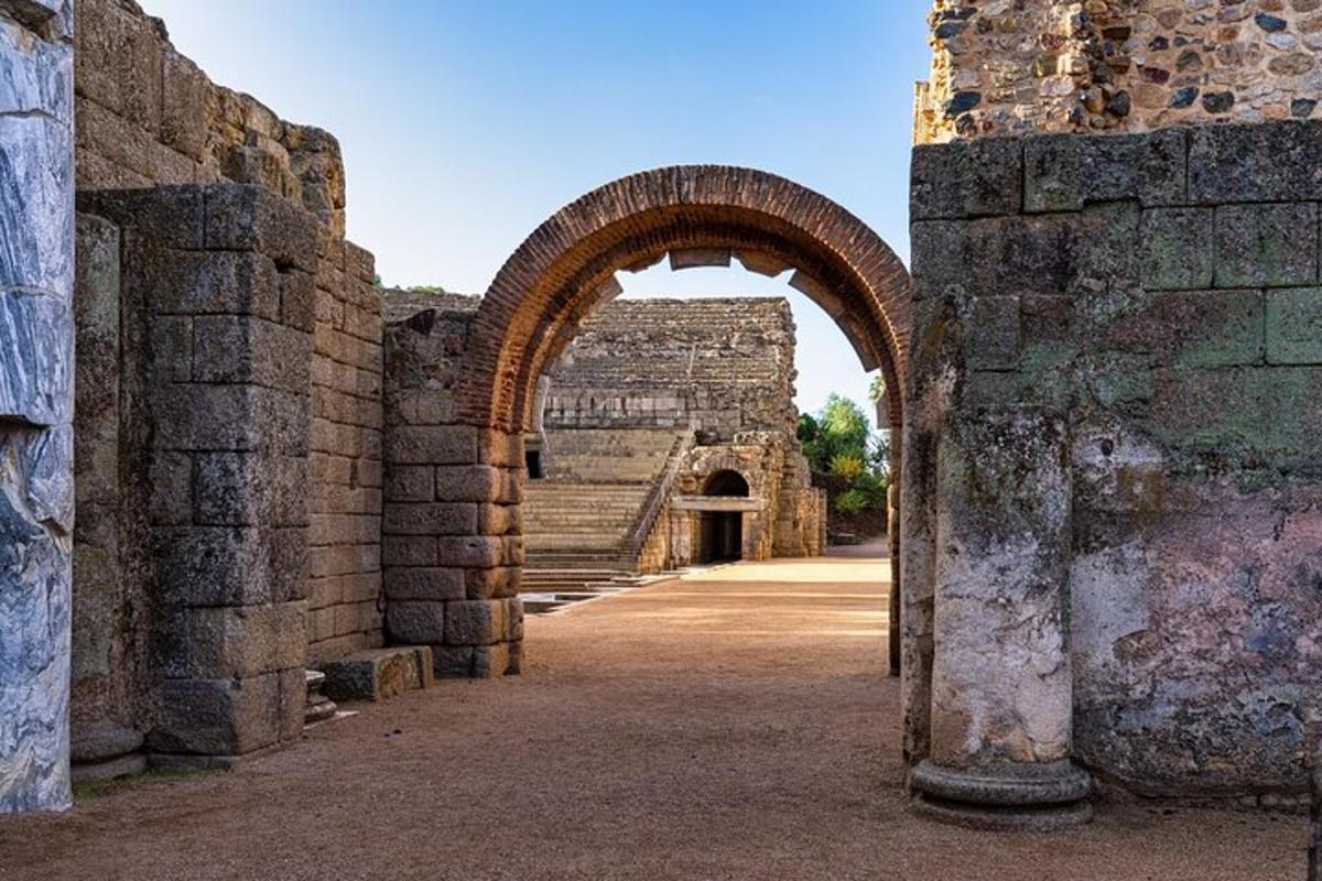 an archway in an old stone building with an entrance