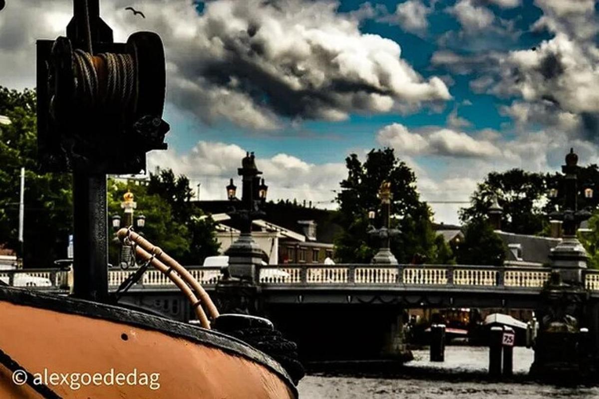 a boat in the water with a bridge in the background