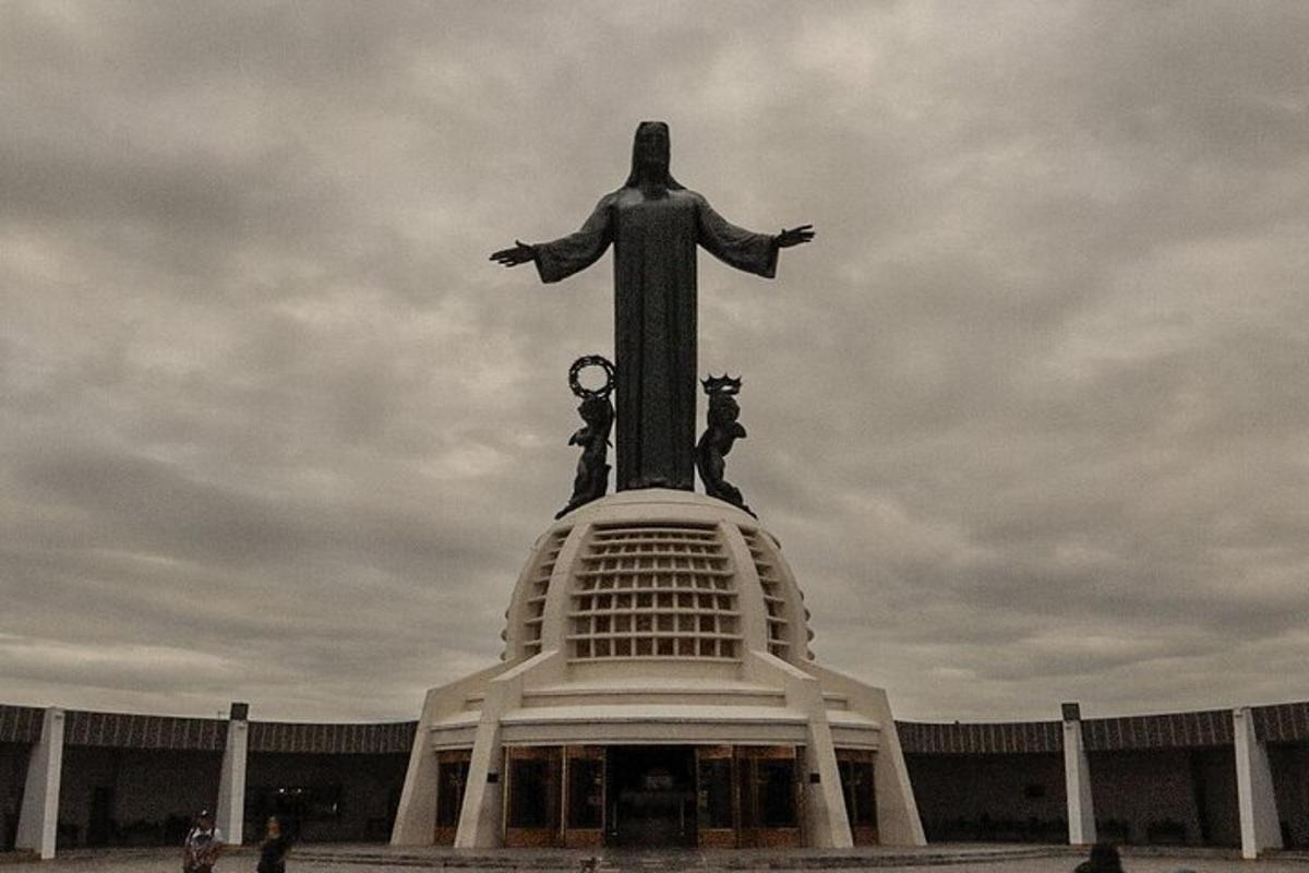 a large statue of a man on top of a building