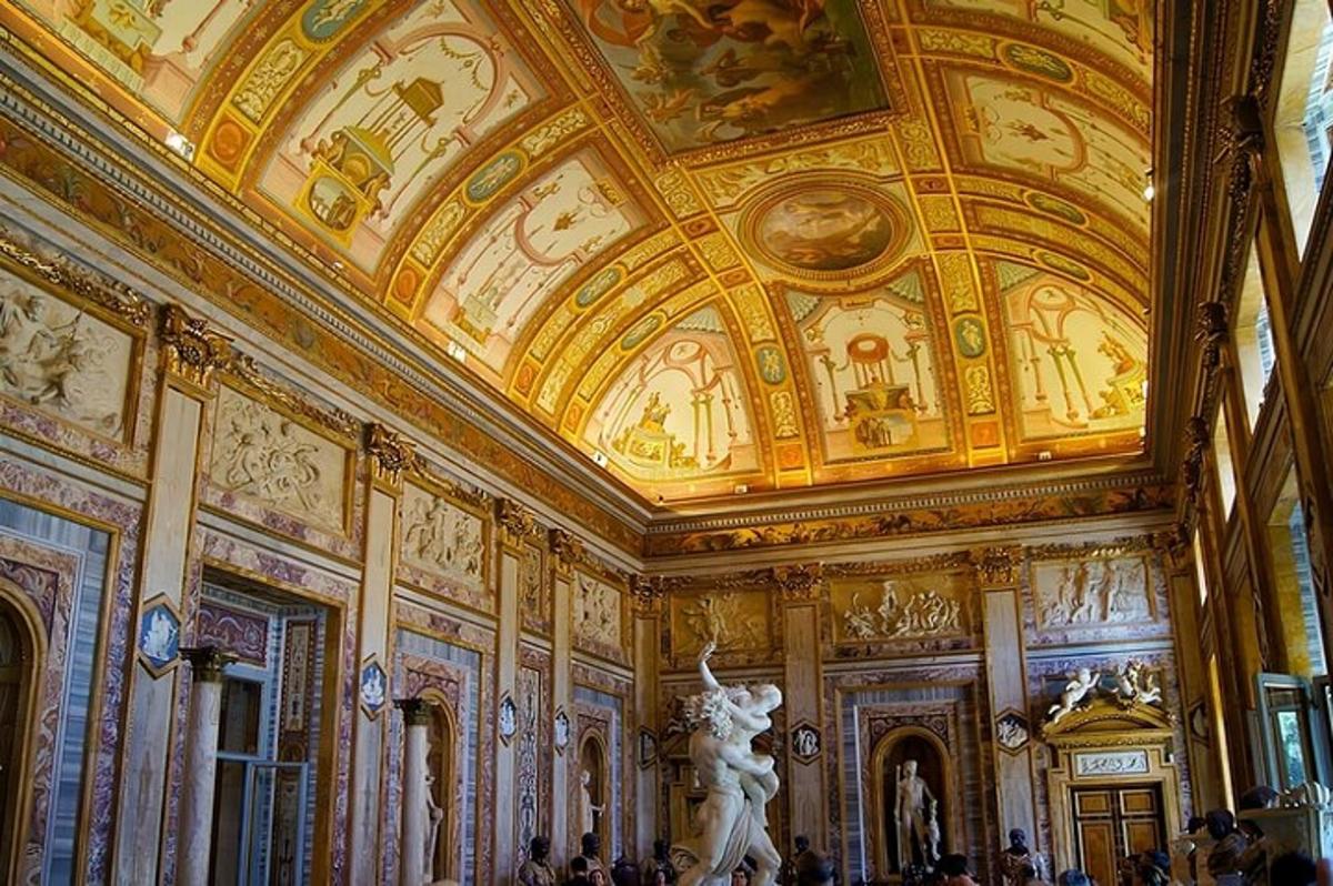 a room with a ceiling with a statue in it
