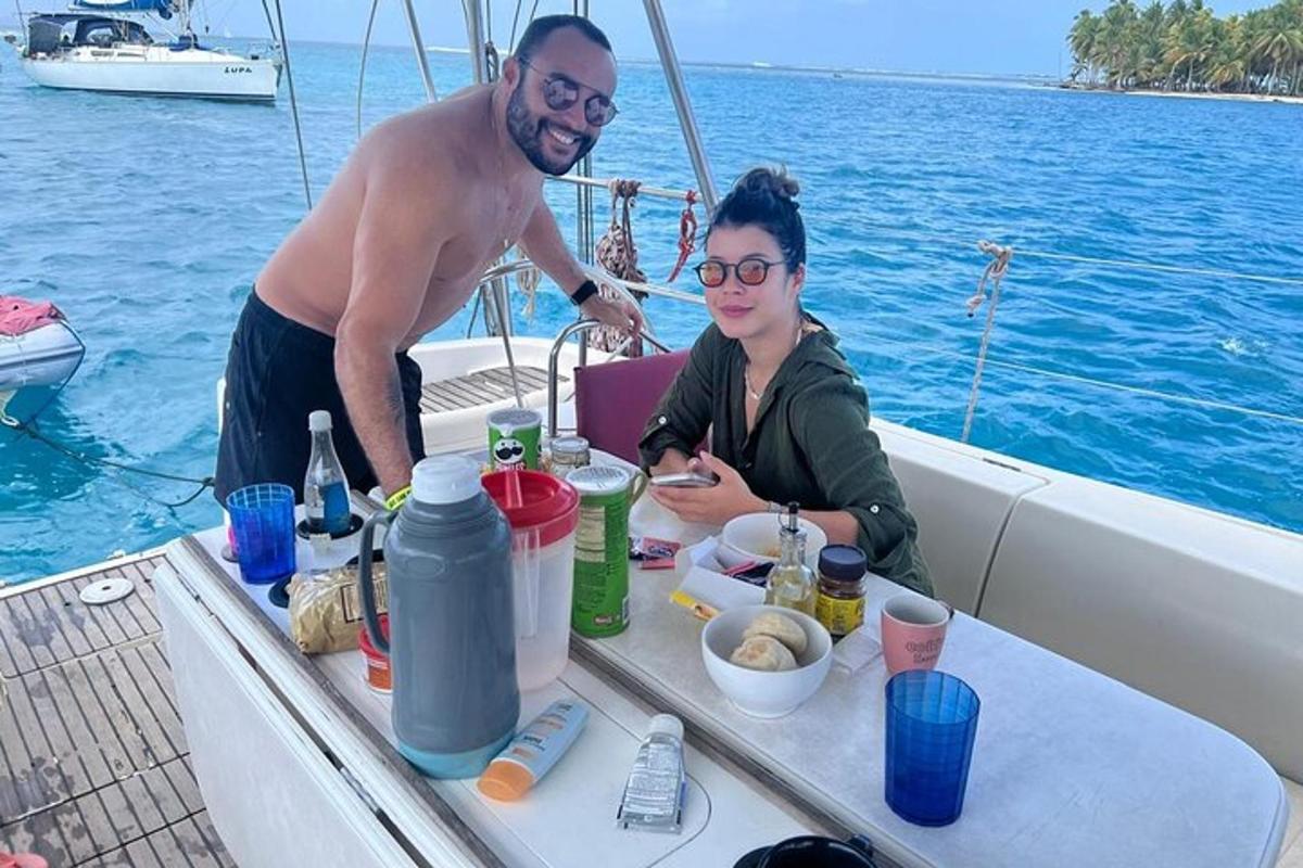 a man and a woman sitting on a boat