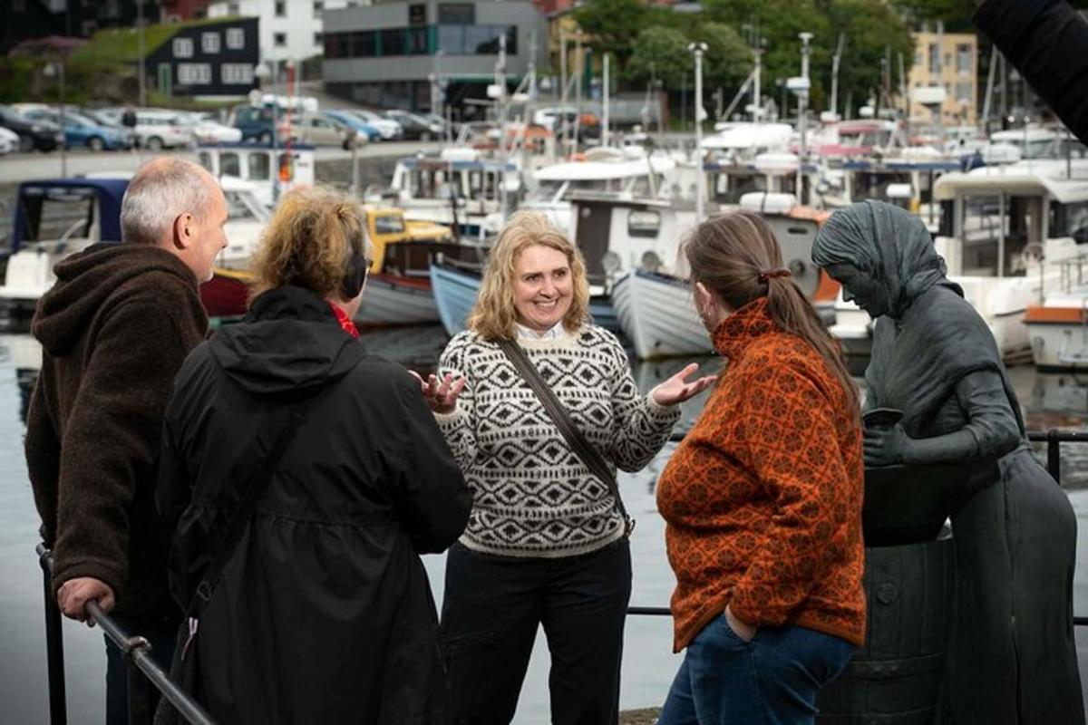 a group of people standing at a marina