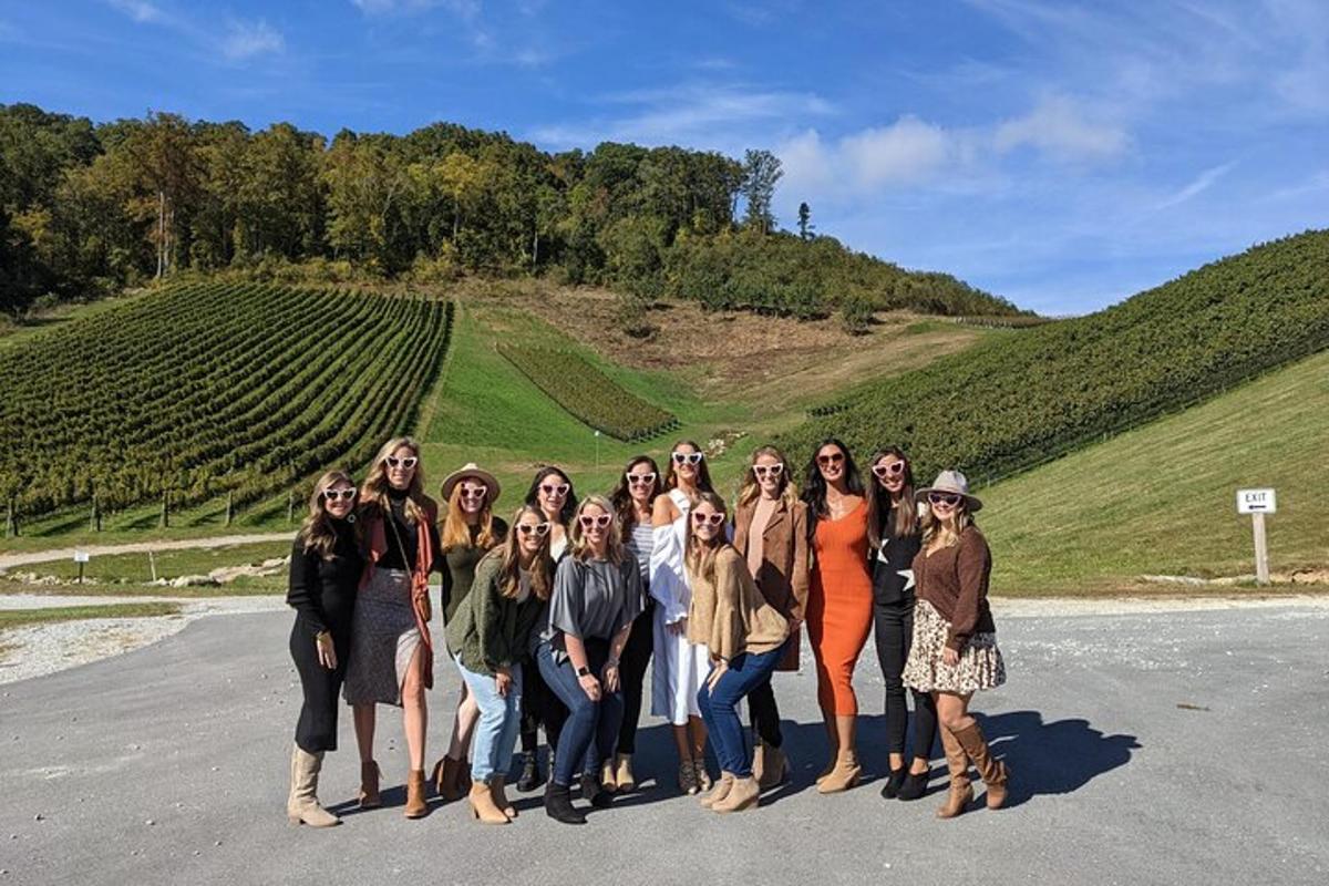 a group of people posing for a picture on a road