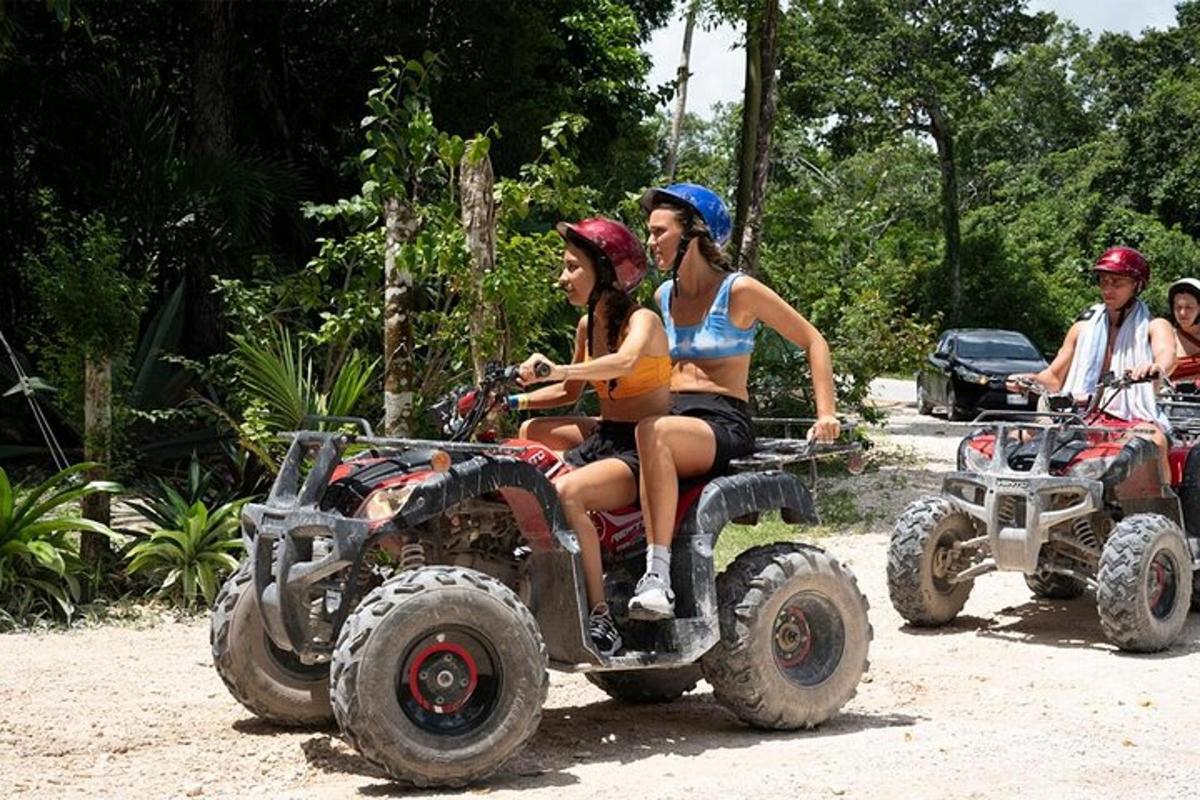 a group of people riding on four wheeler atvs