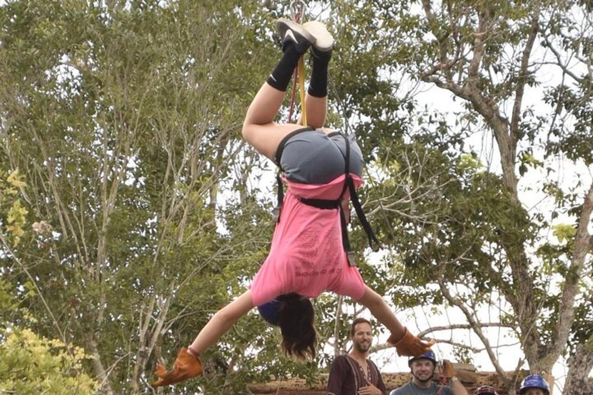 a girl is doing a handstand in the air