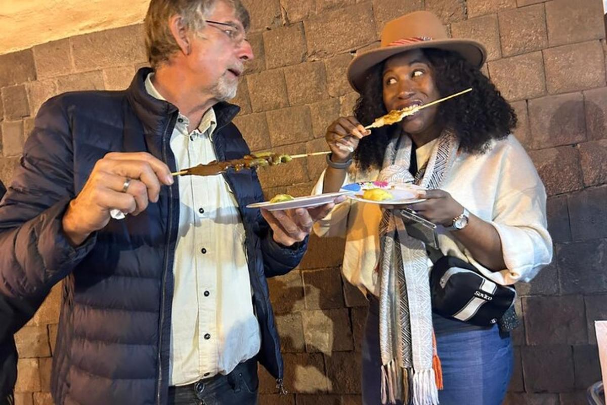 a man and a woman eating food on a plate