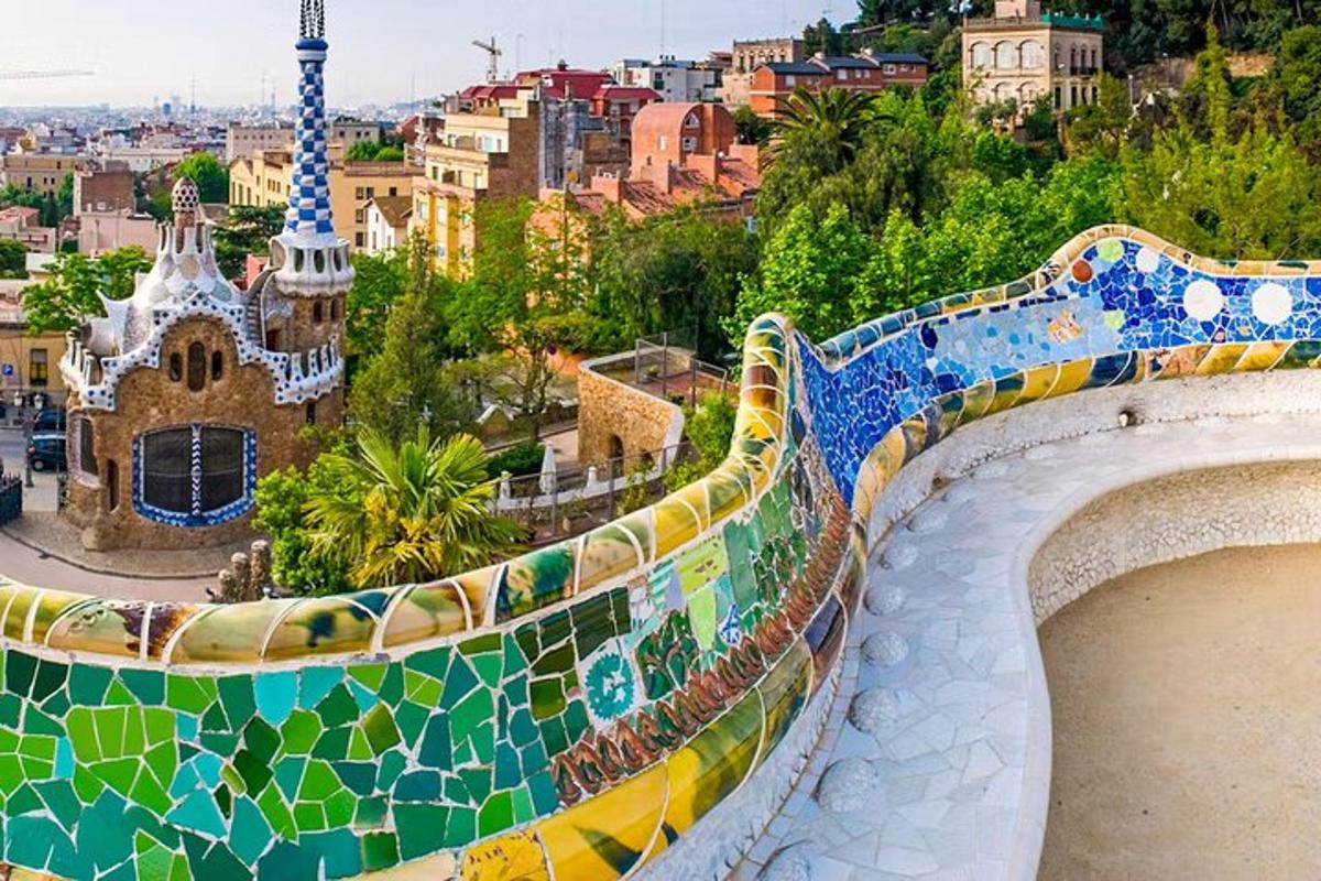 a mosaic fence with a view of a city