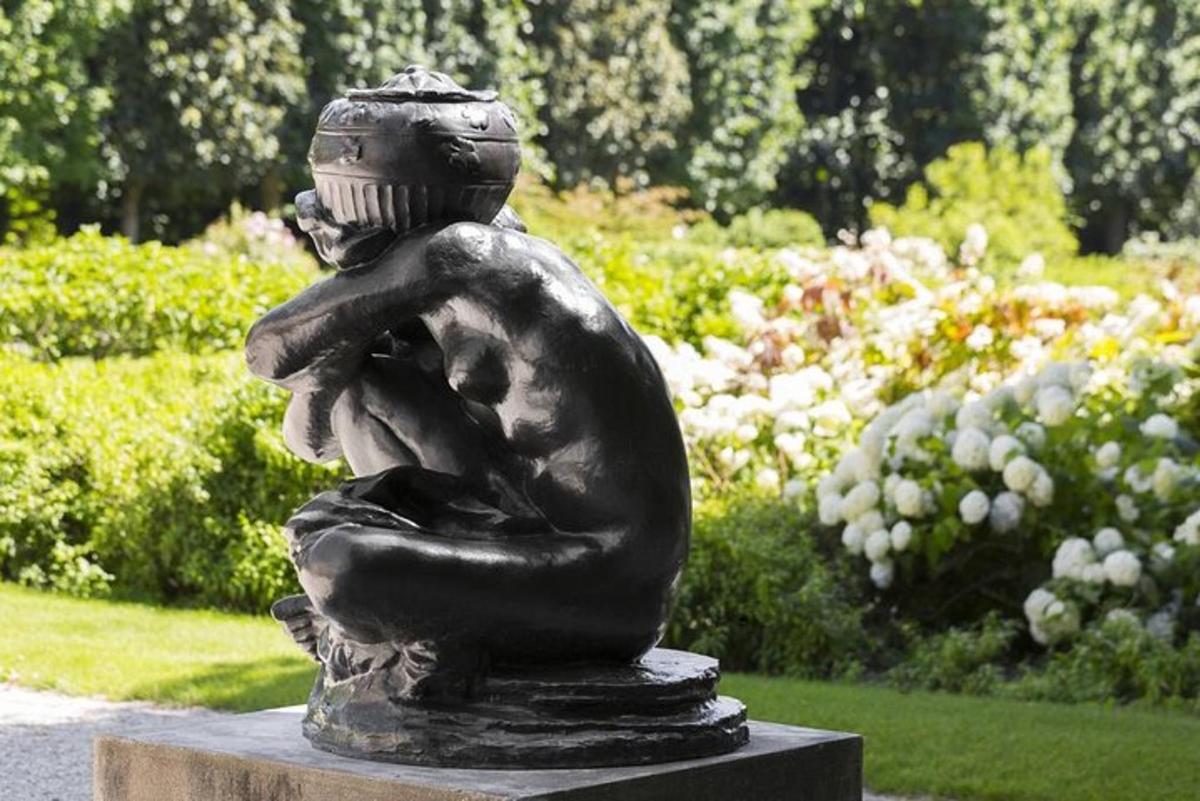 a statue of a boy hugging a child