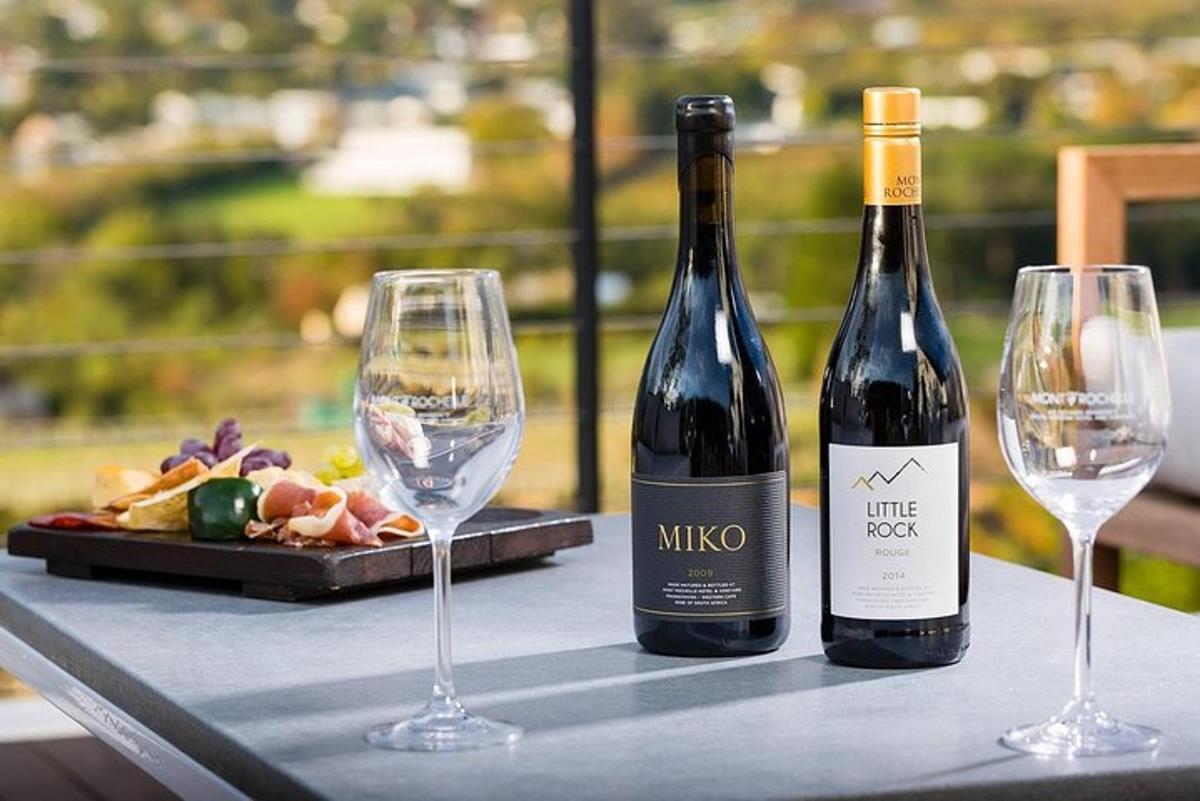two bottles of wine and two glasses on a table