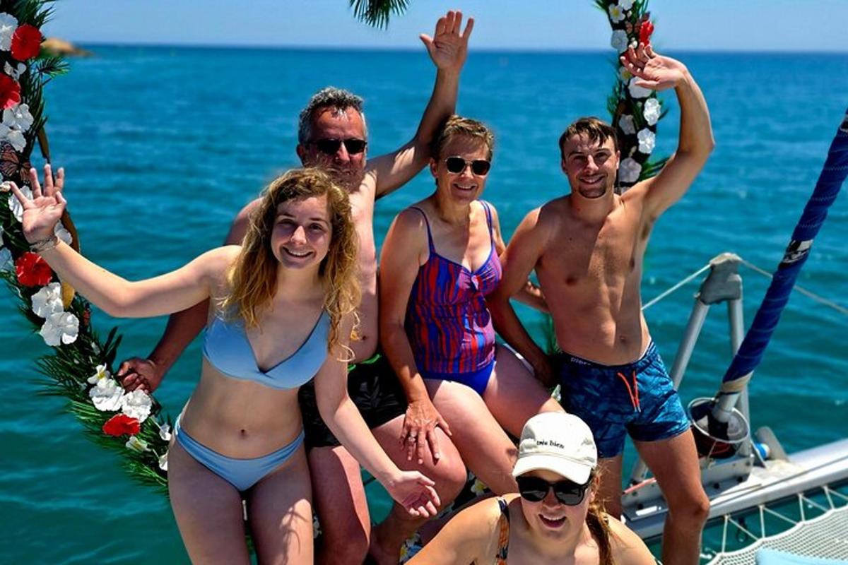 a group of people in bathing suits on a boat