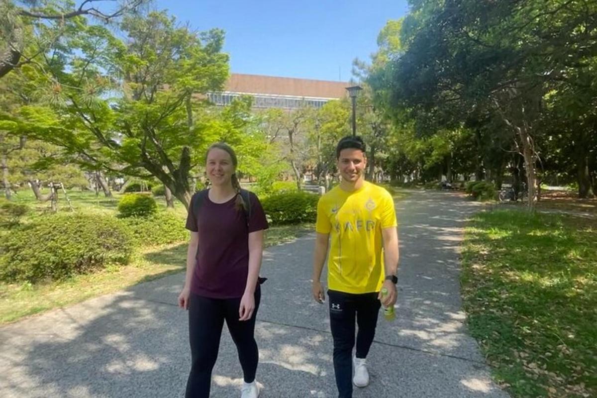 a man and a woman walking down a road
