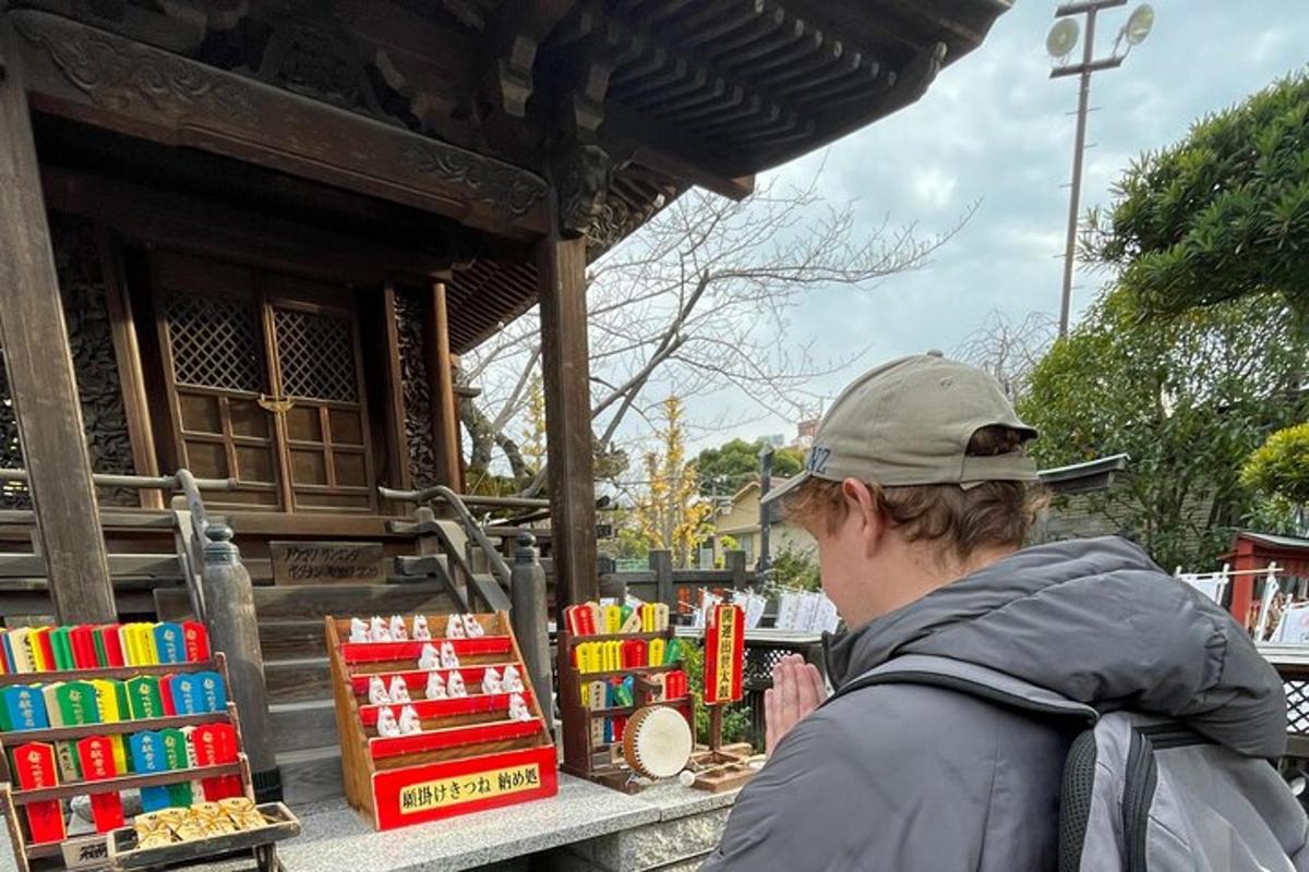 a man standing in front of a building looking at books