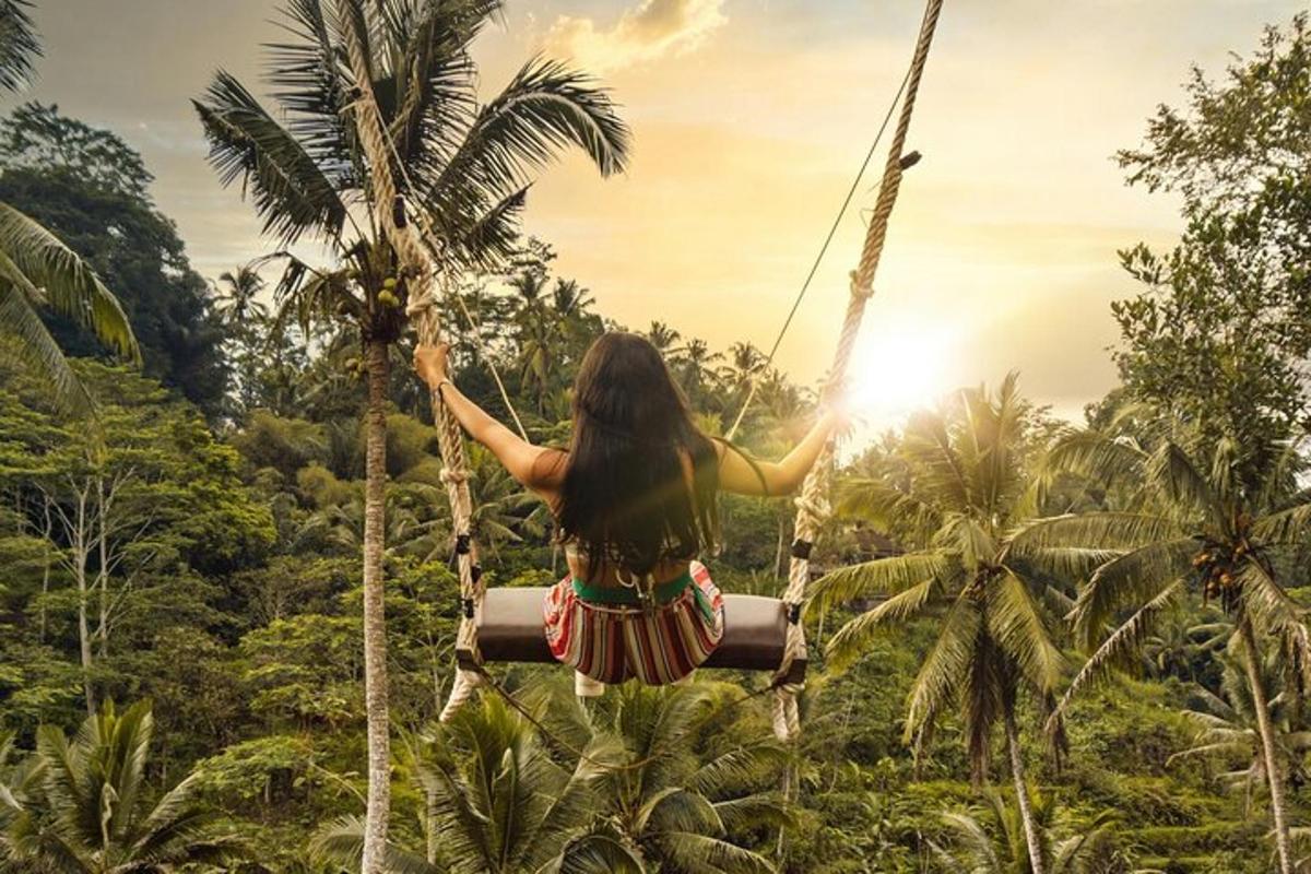 a woman on a rope swing in the jungle