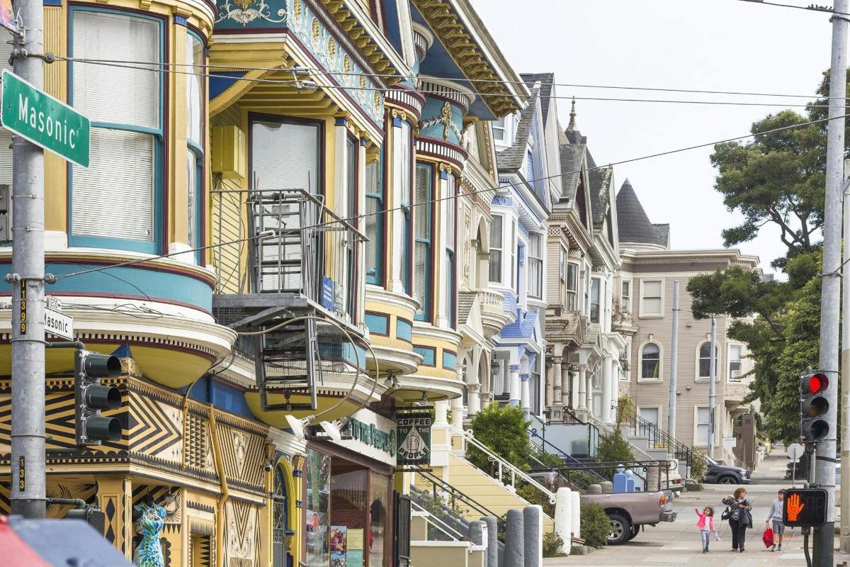 a group of buildings on the side of a street