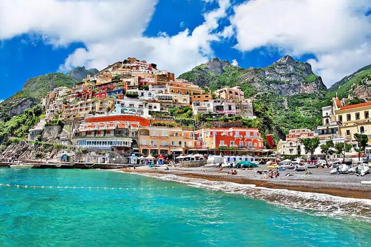 a town on a mountain with a beach and water