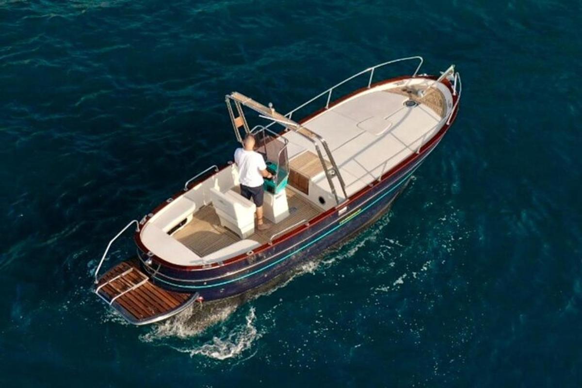 a man standing on a boat in the water