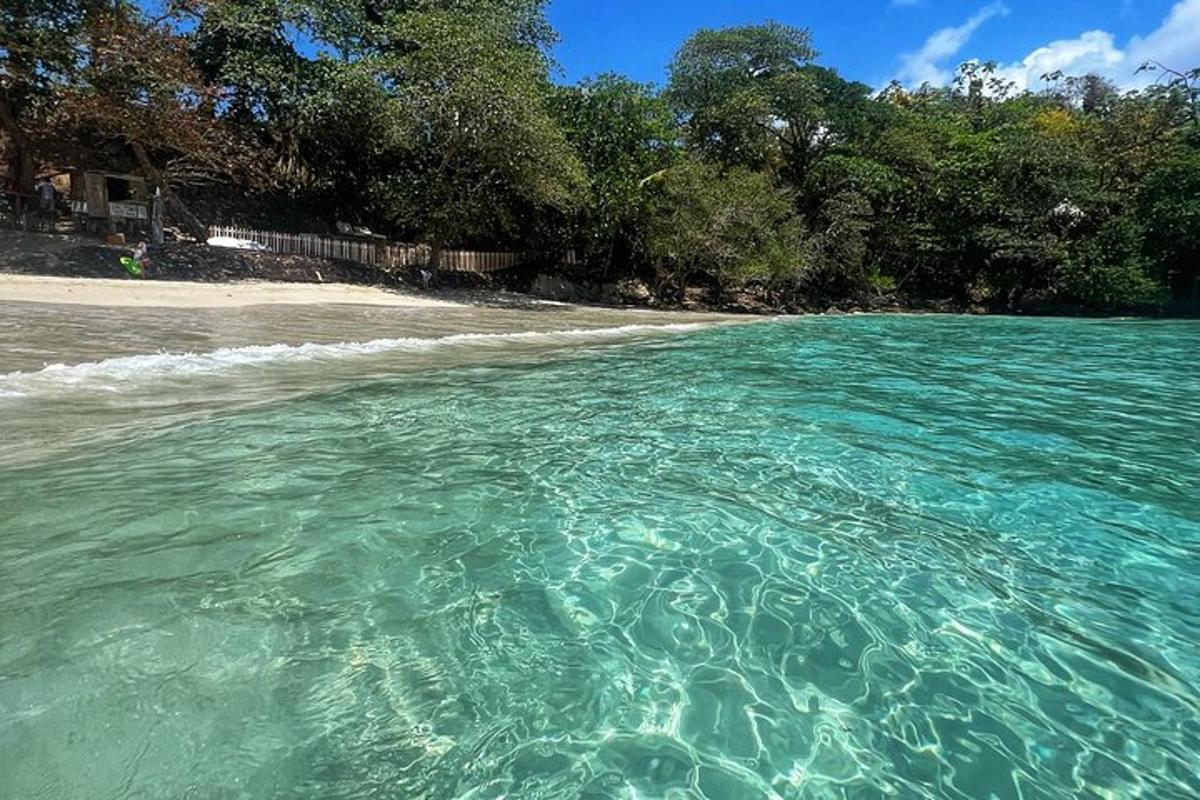 a view of a beach with crystal blue water