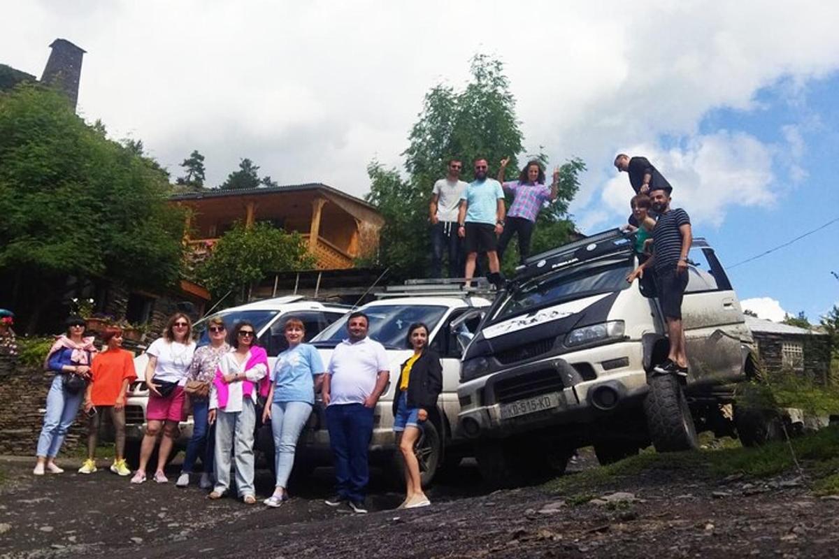 a group of people standing on the hood of a truck