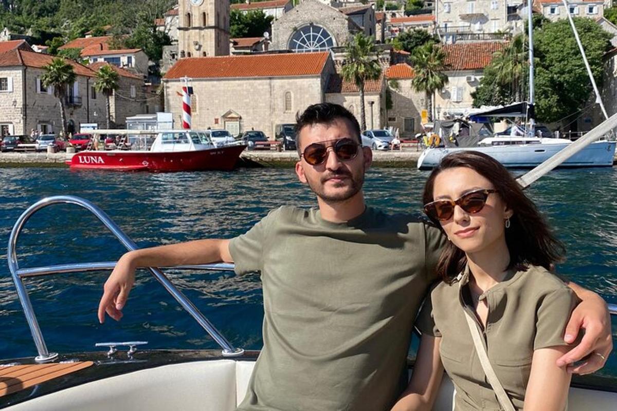 a man and a woman on a boat in the water