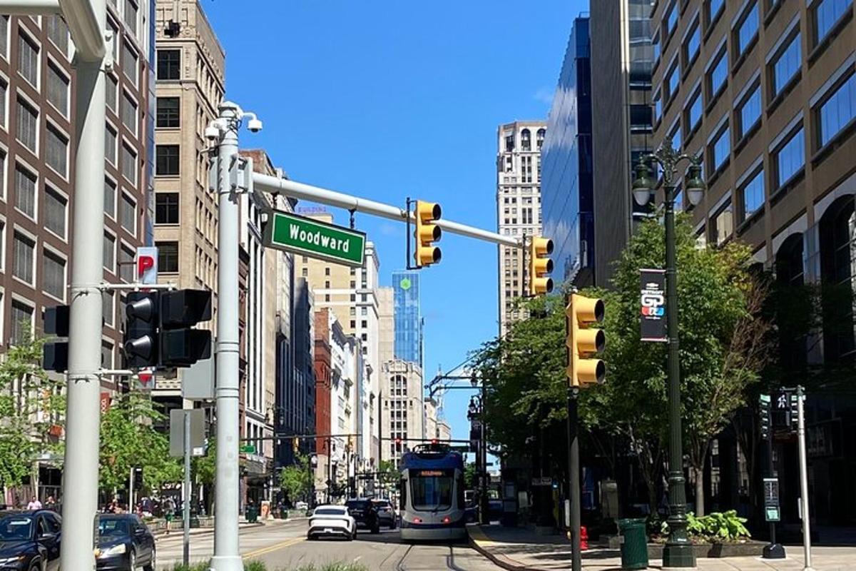 a street sign and traffic lights in a city