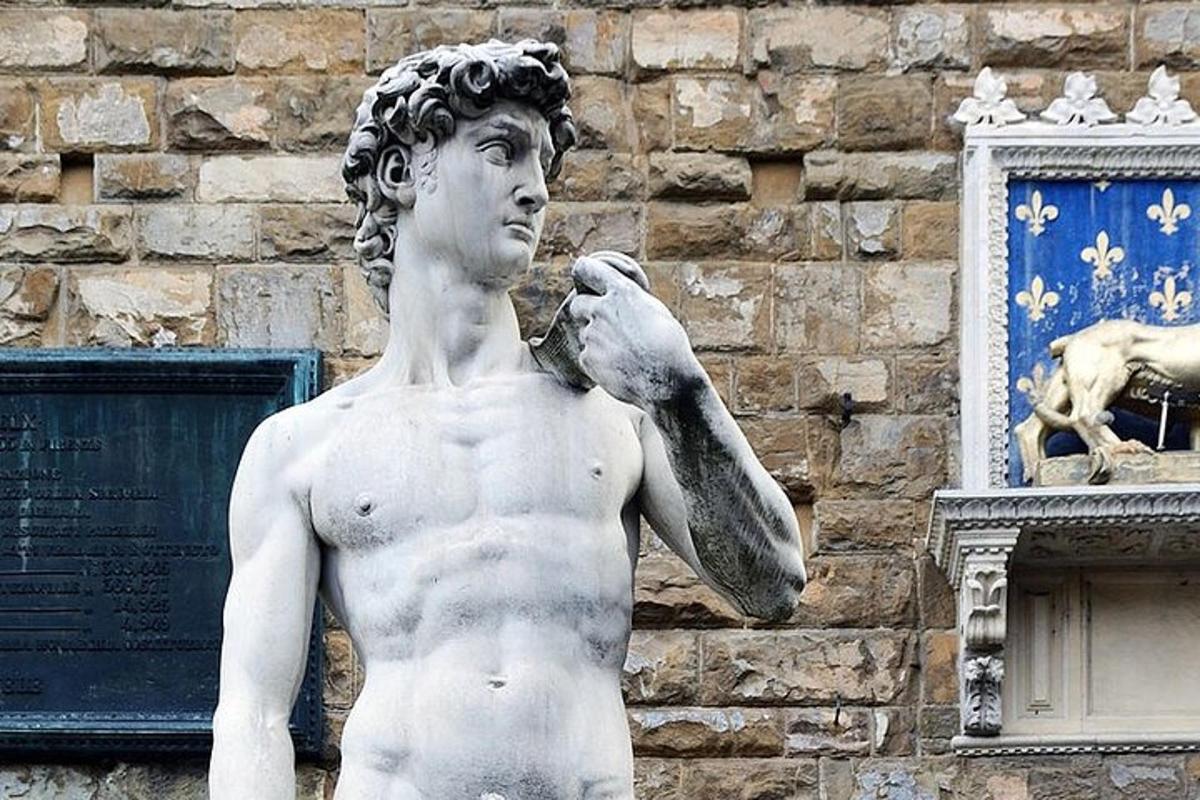 a statue of a man with a bird in his hand