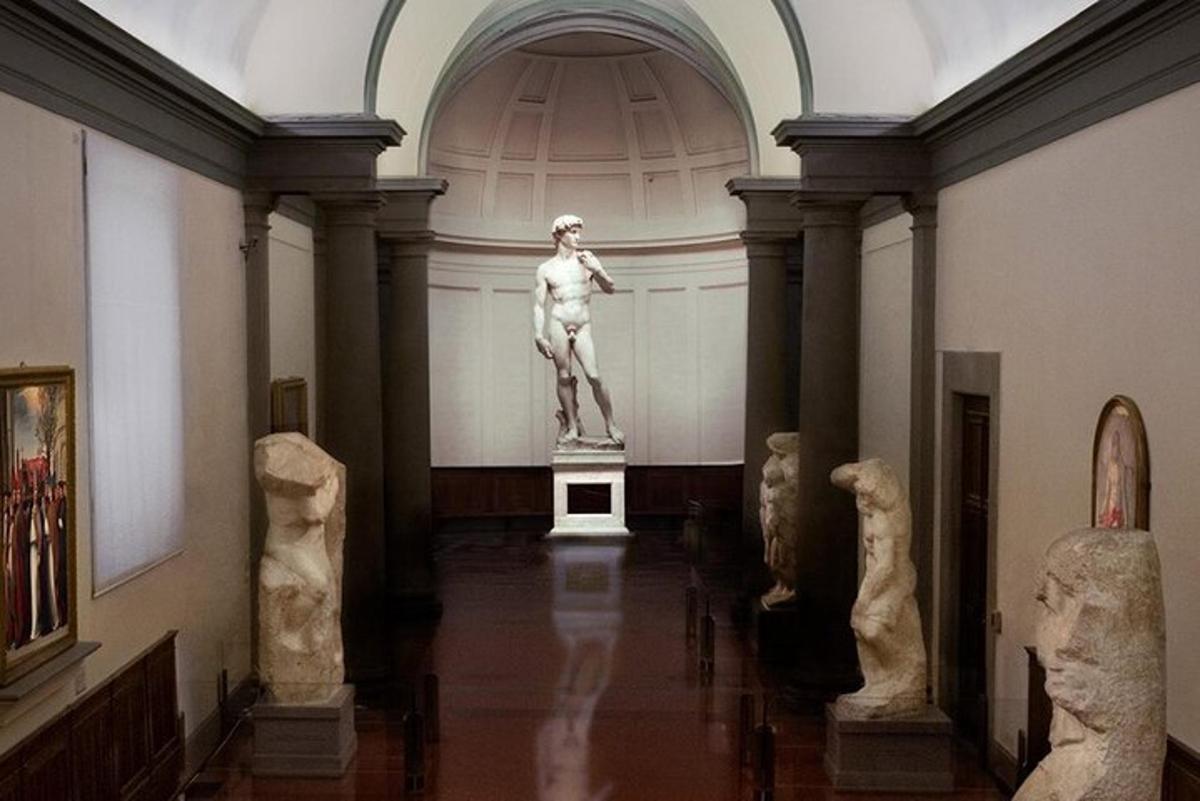 a museum with a statue in the middle of a room
