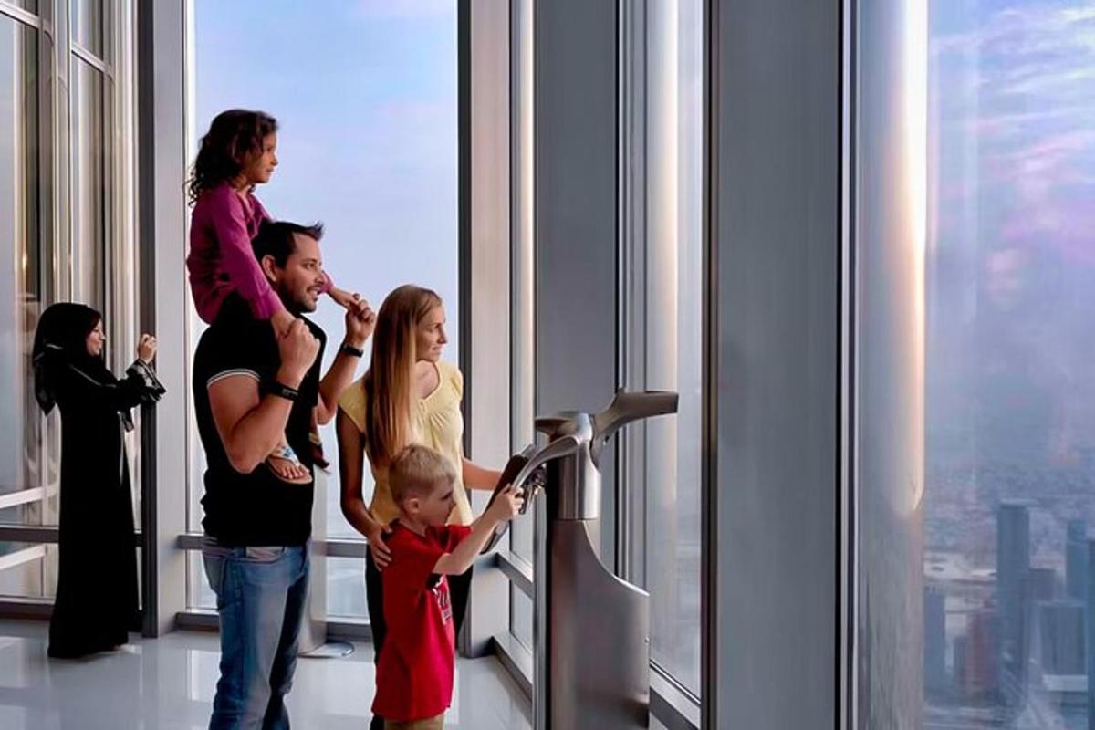 a family looking at a window in a skyscraper