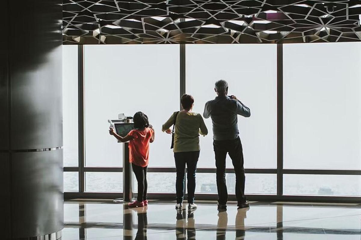 a group of three people standing in front of a window
