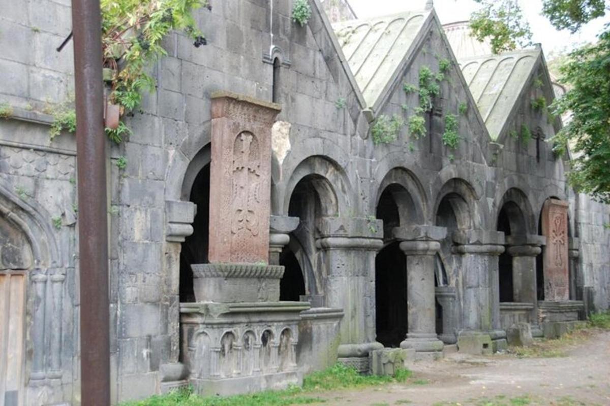 an old stone building with a fountain in it