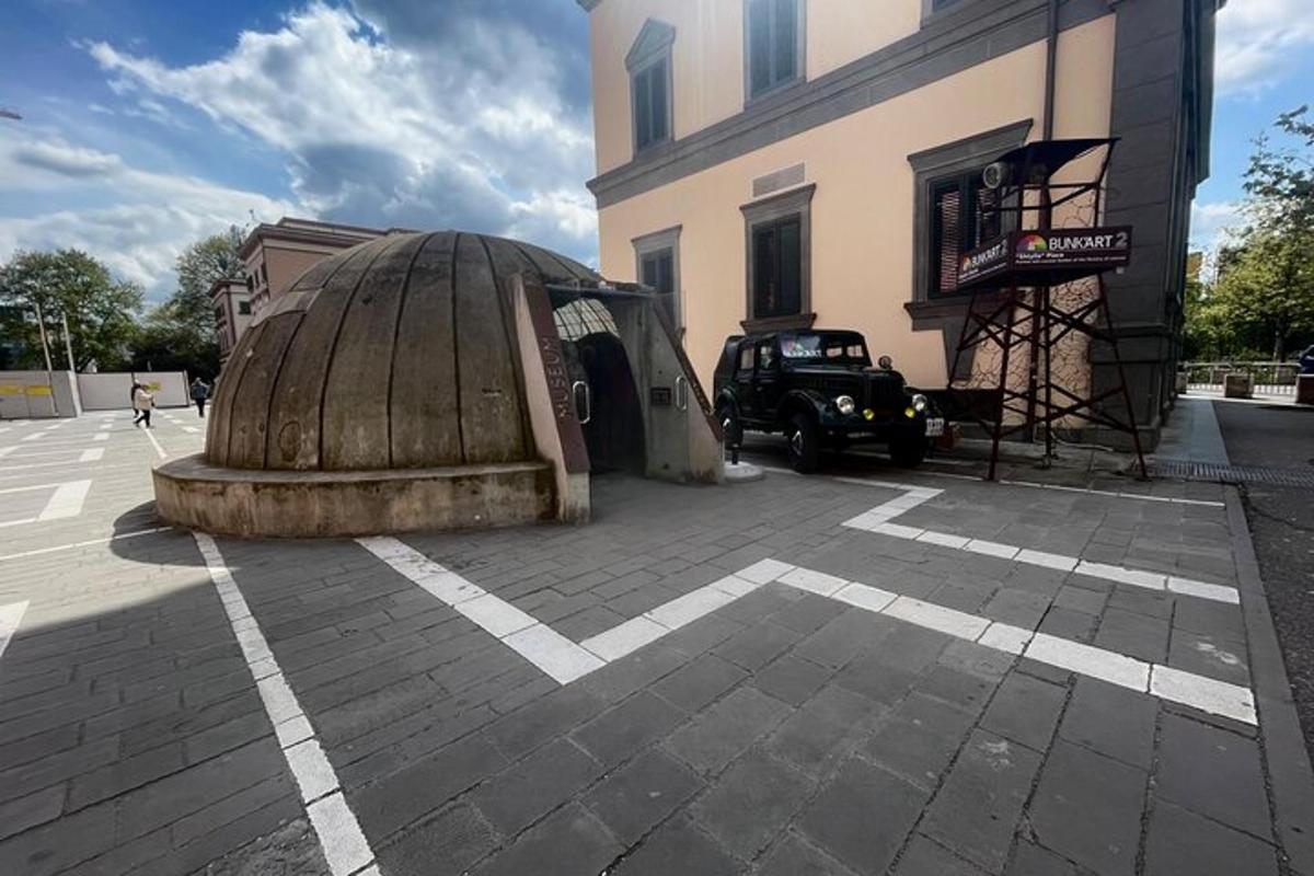 a large building with a domed building with a truck next to it