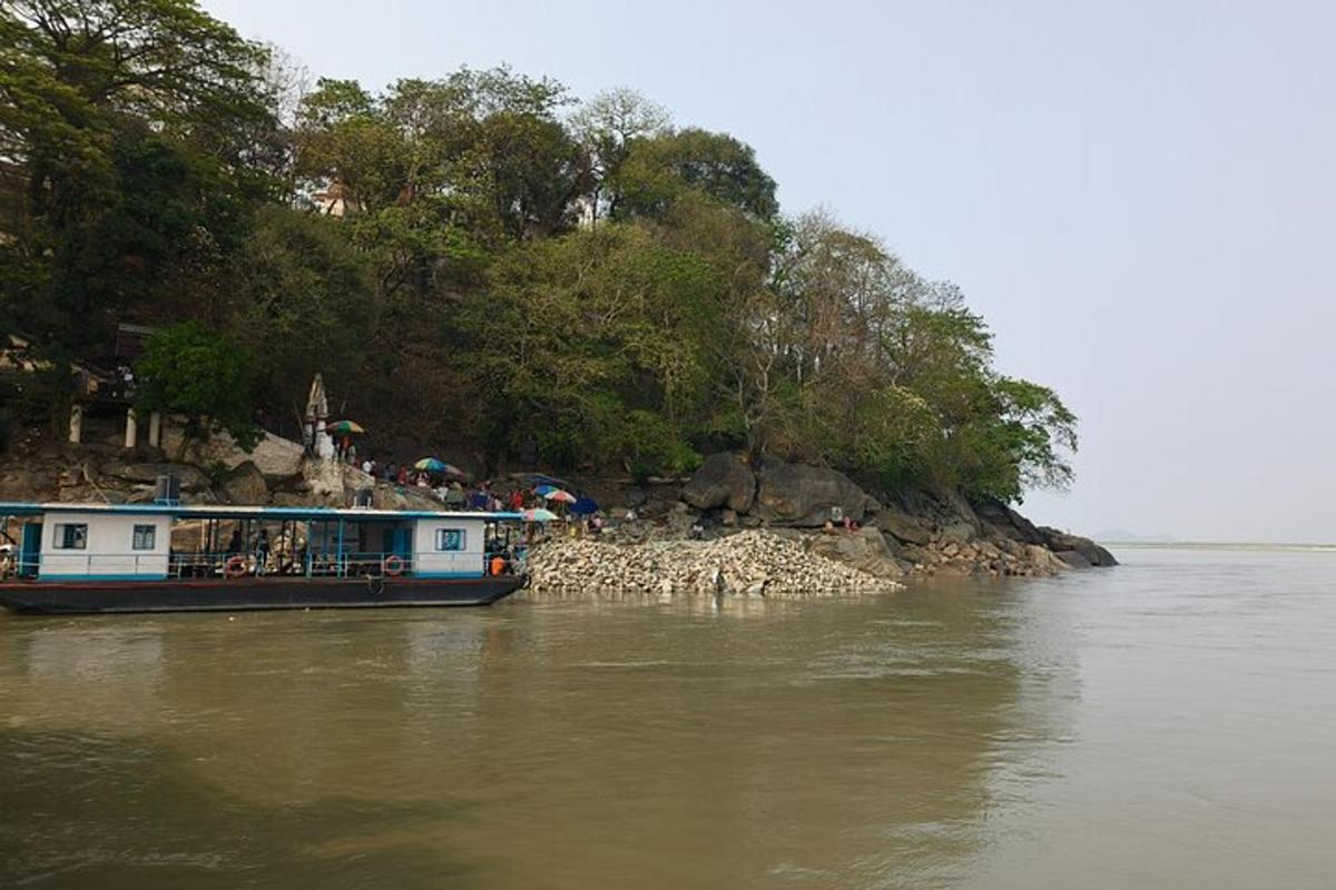 a boat on the water next to an island