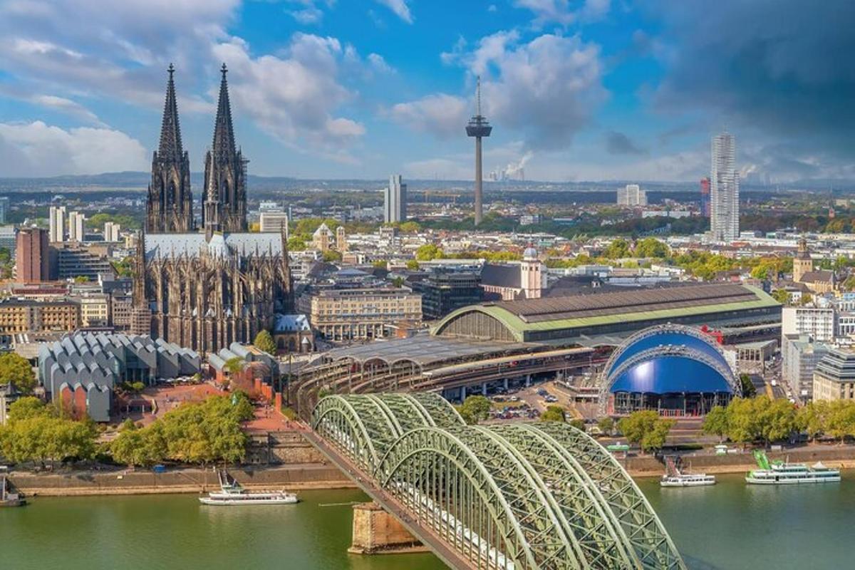 a view of a city with a bridge and a cathedral