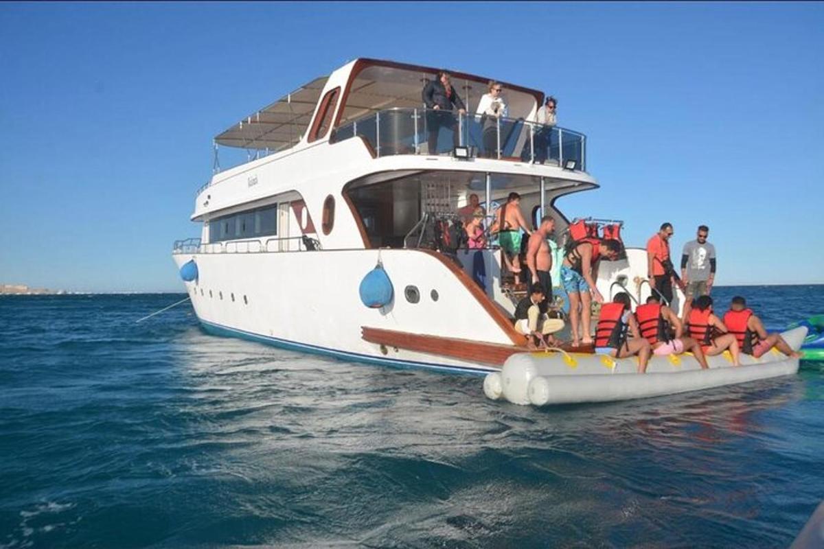 a group of people on a boat in the water