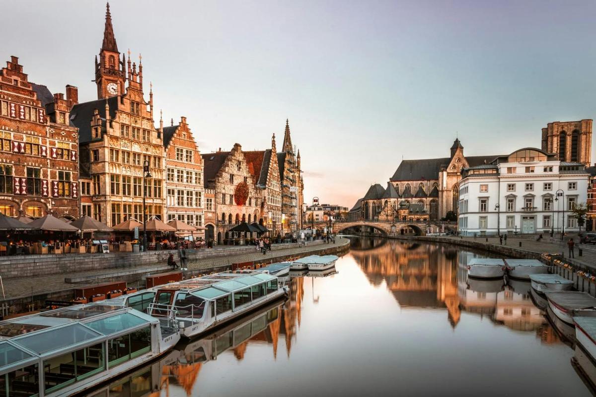 a river in a city with boats in the water