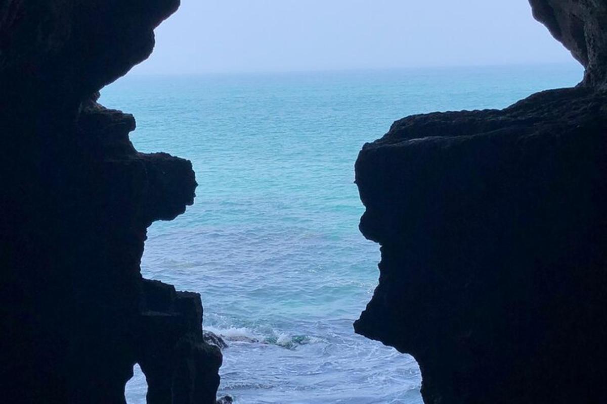 a view of the ocean from a cave