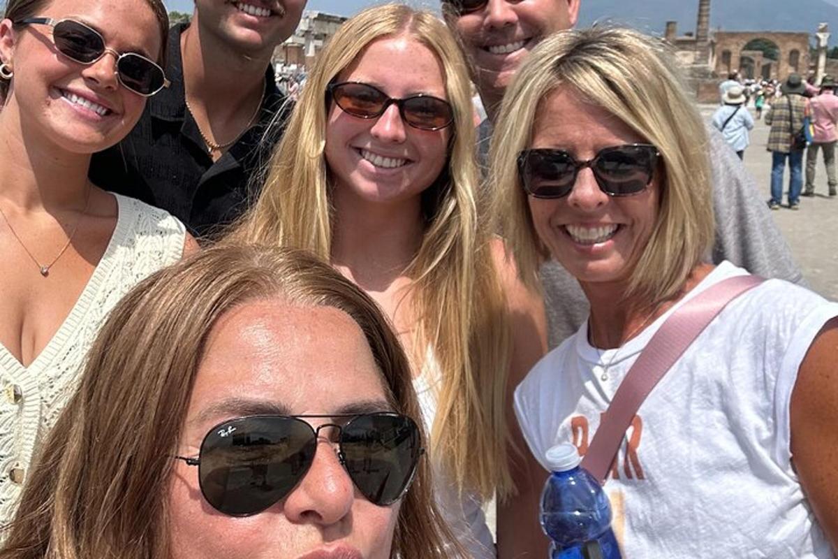 a group of people are posing for a picture