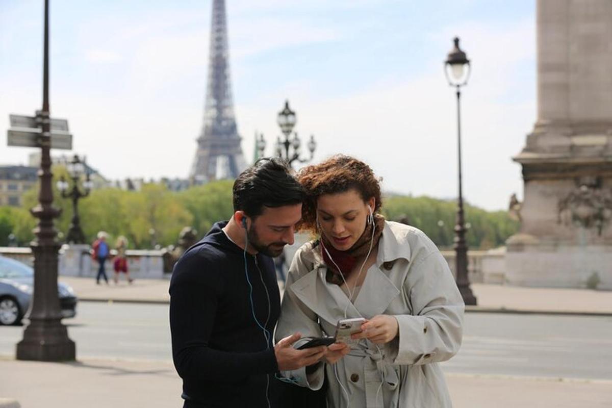 a man and a woman looking at a cell phone