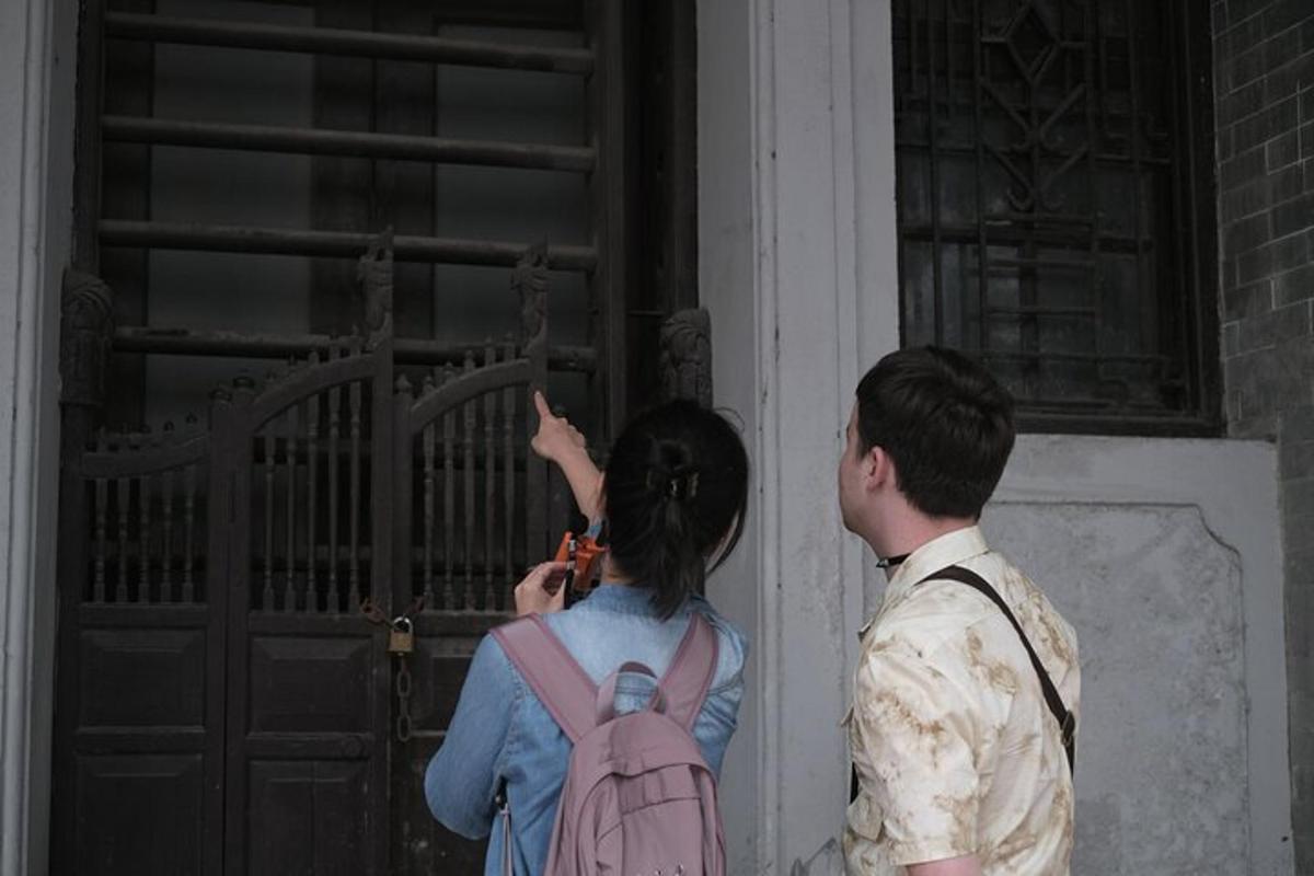 a man and a woman standing in front of a door