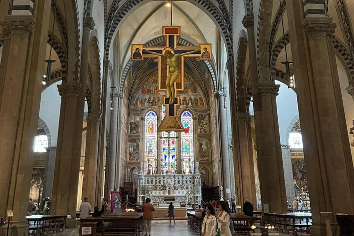 a large cathedral with a cross and a stained glass window
