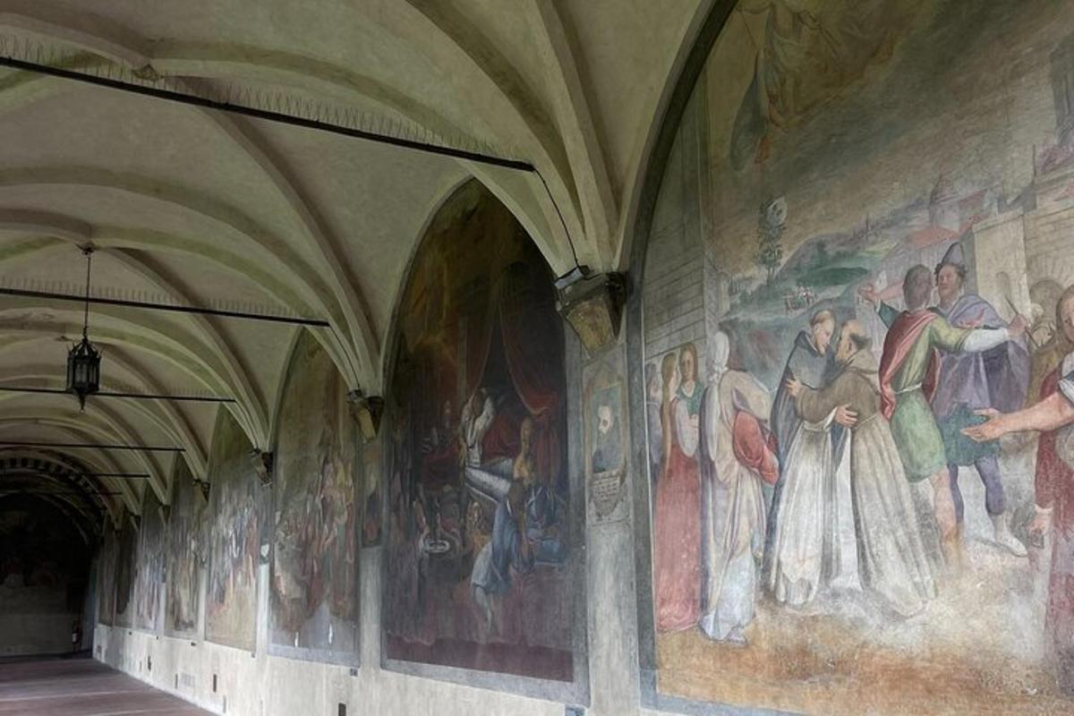 a wall with paintings on the side of a building