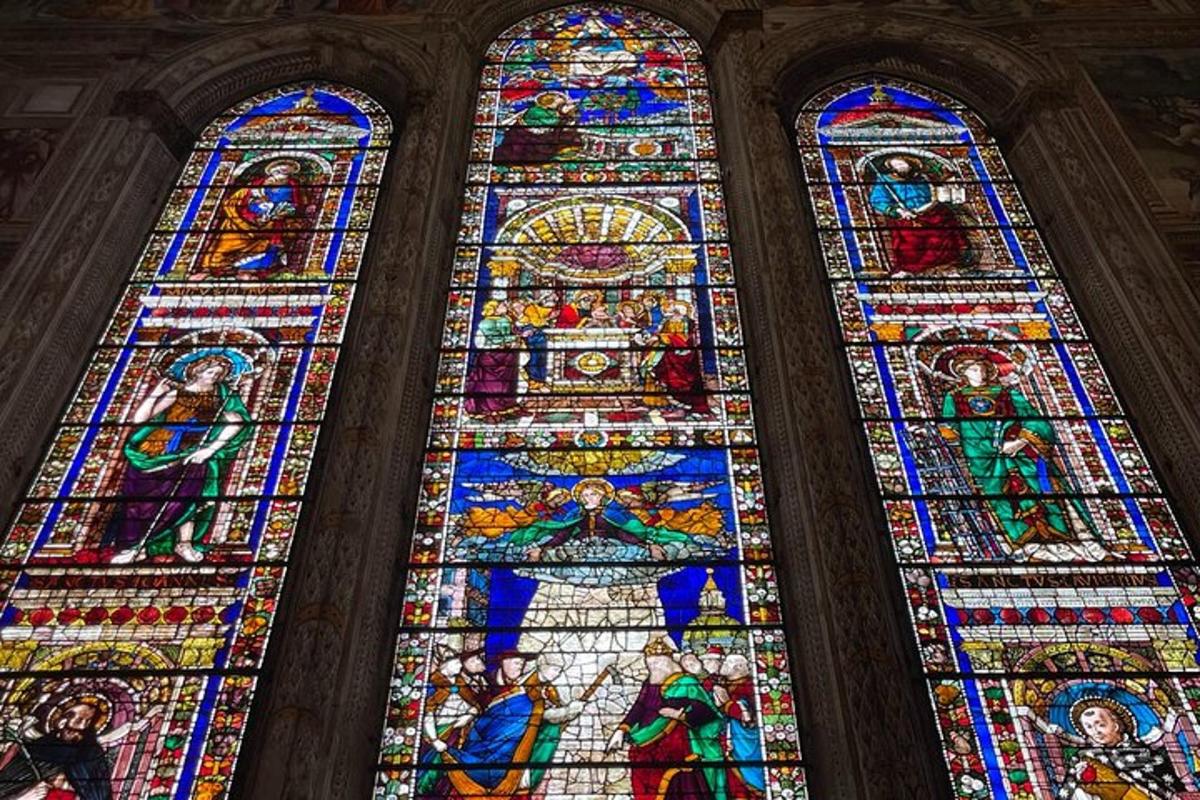 a large stained glass window in a church