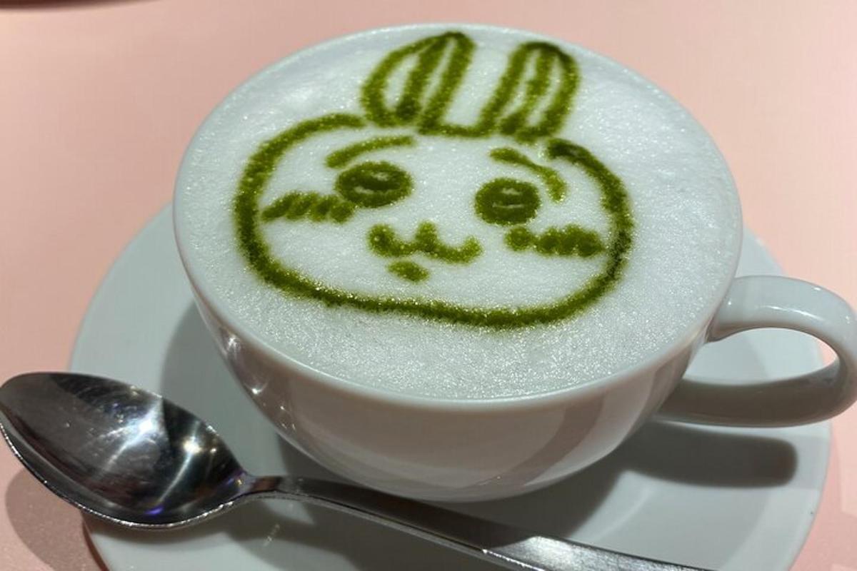 a cup of coffee with a face drawn on it