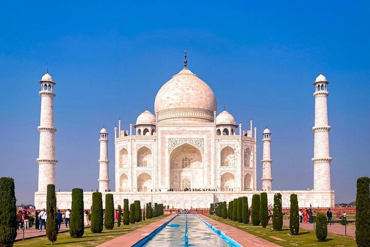 a view of the taj mahal with trees in front
