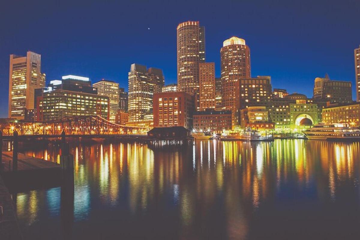 a view of a city at night with the water
