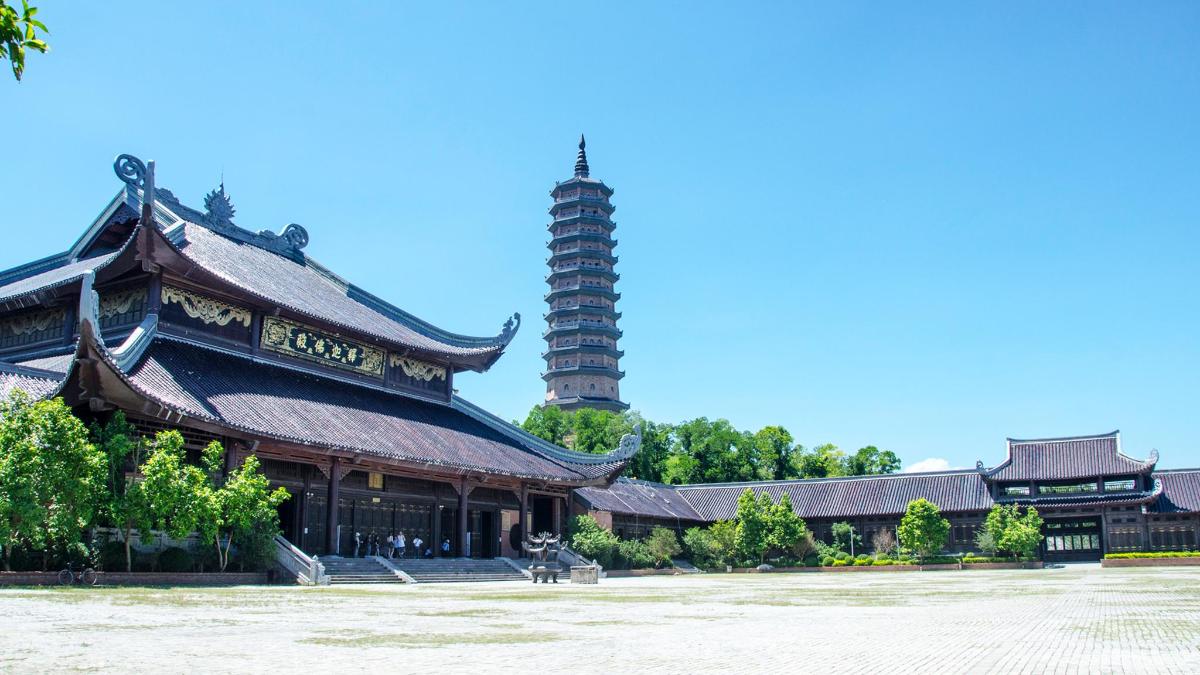a large building with a tower in the background