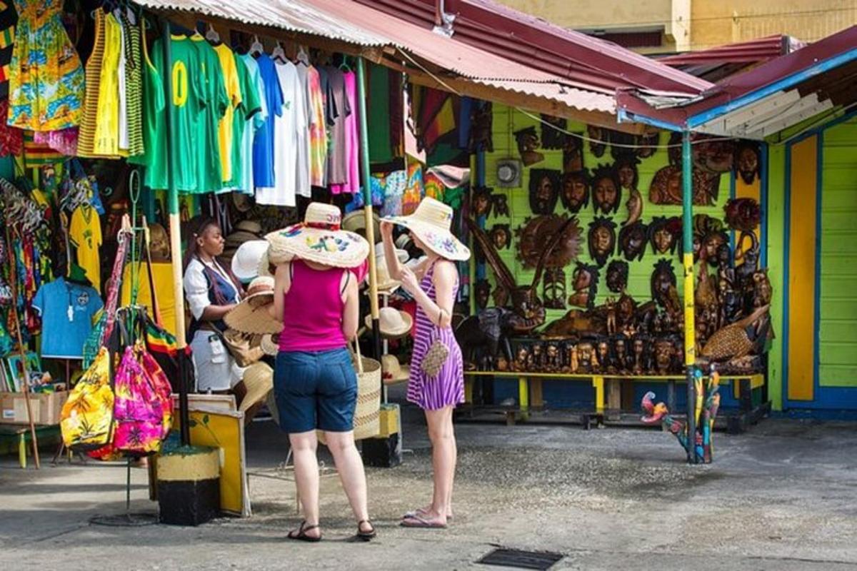 two women standing in front of a market withpricedpricedpricedpriced