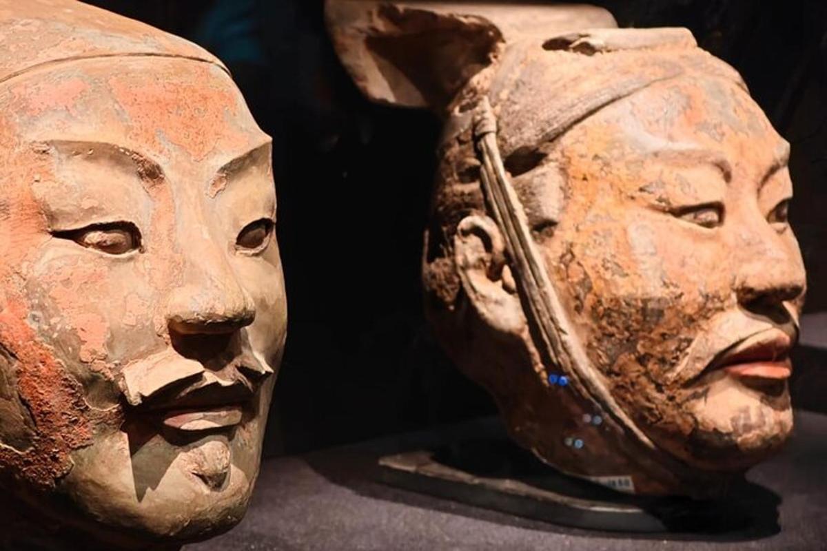 a statue of two heads next to each other
