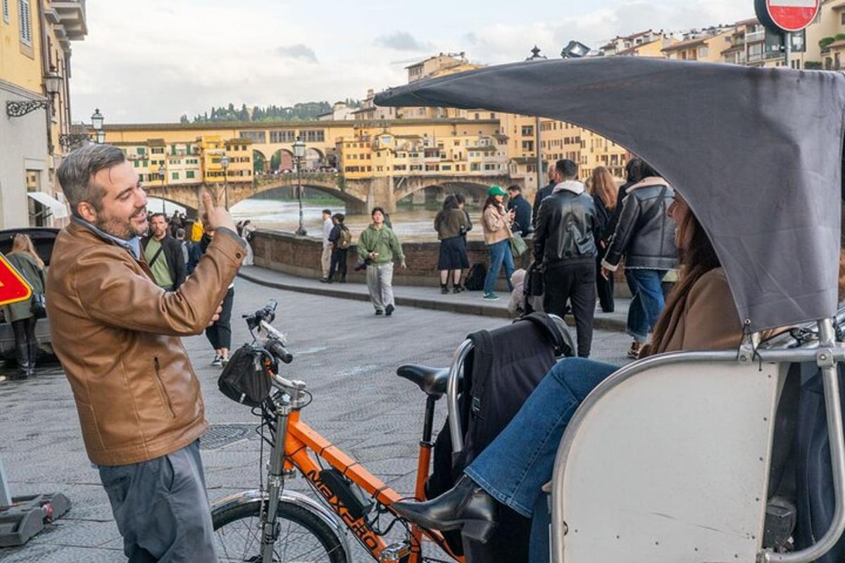 a man standing next to a bike with its hood up